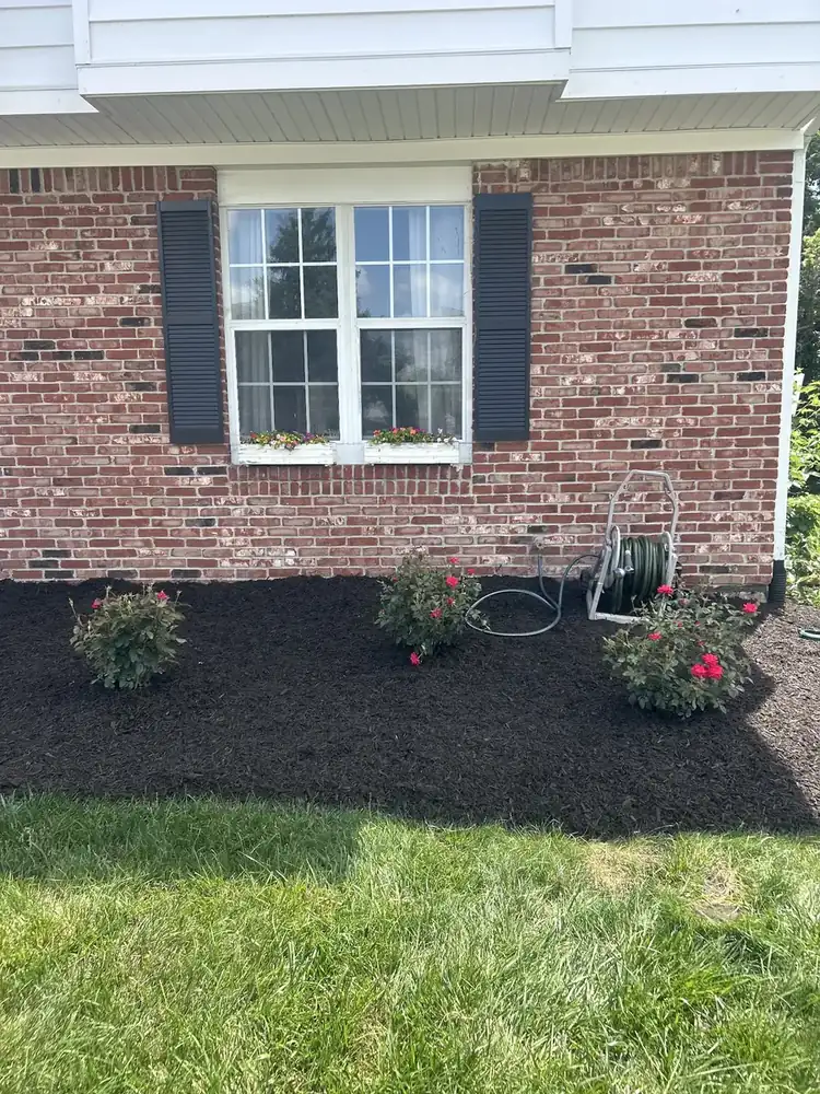 Front bed at a brick home