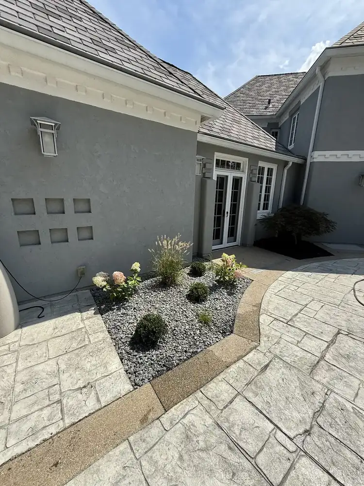 Decorative rock bed beside a patio