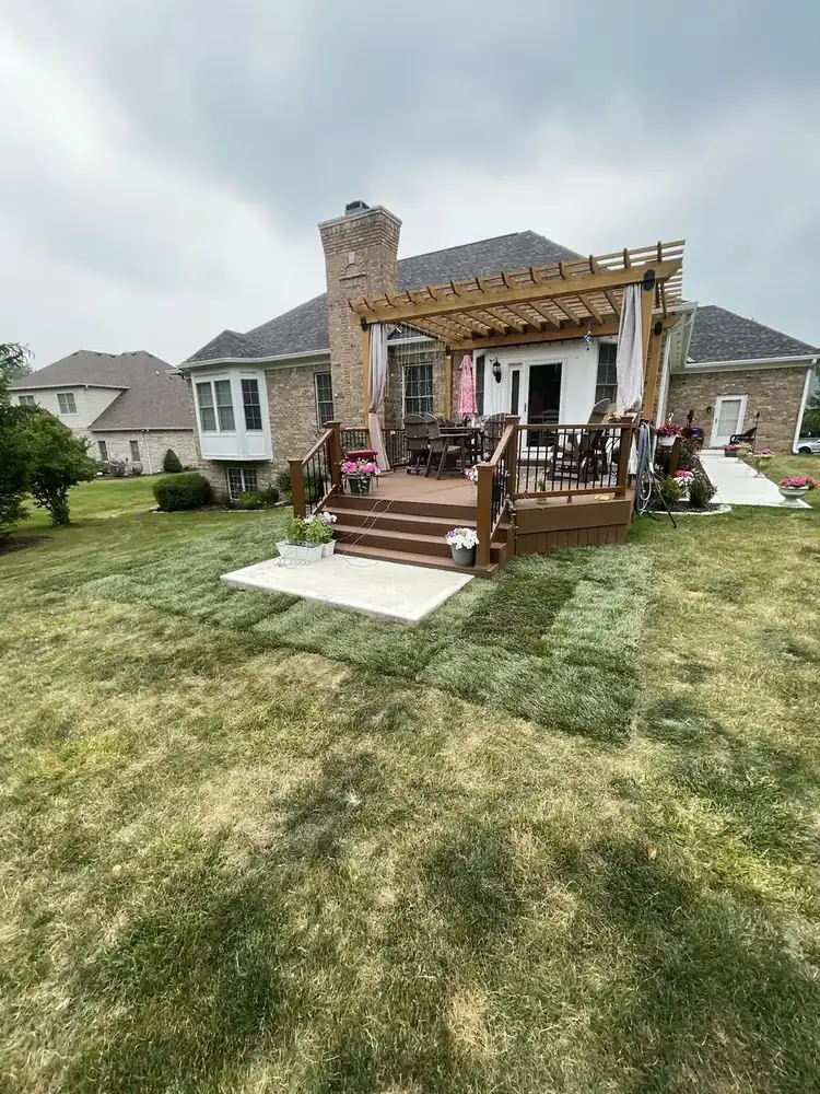 Maintained backyard lawn near a pergola