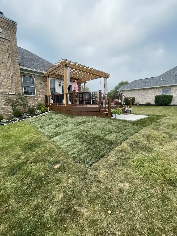 The same backyard area after new sod installation by Js Design